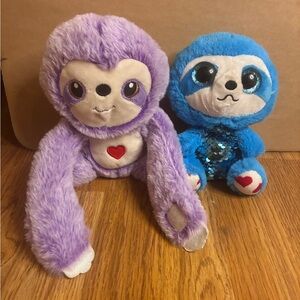 Set Of Cute Sloth Stuffed Animal Plushies Purple With Heart And Blue Sparkles.